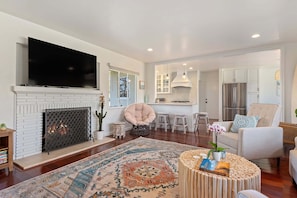 Smart TV, fireplace, books