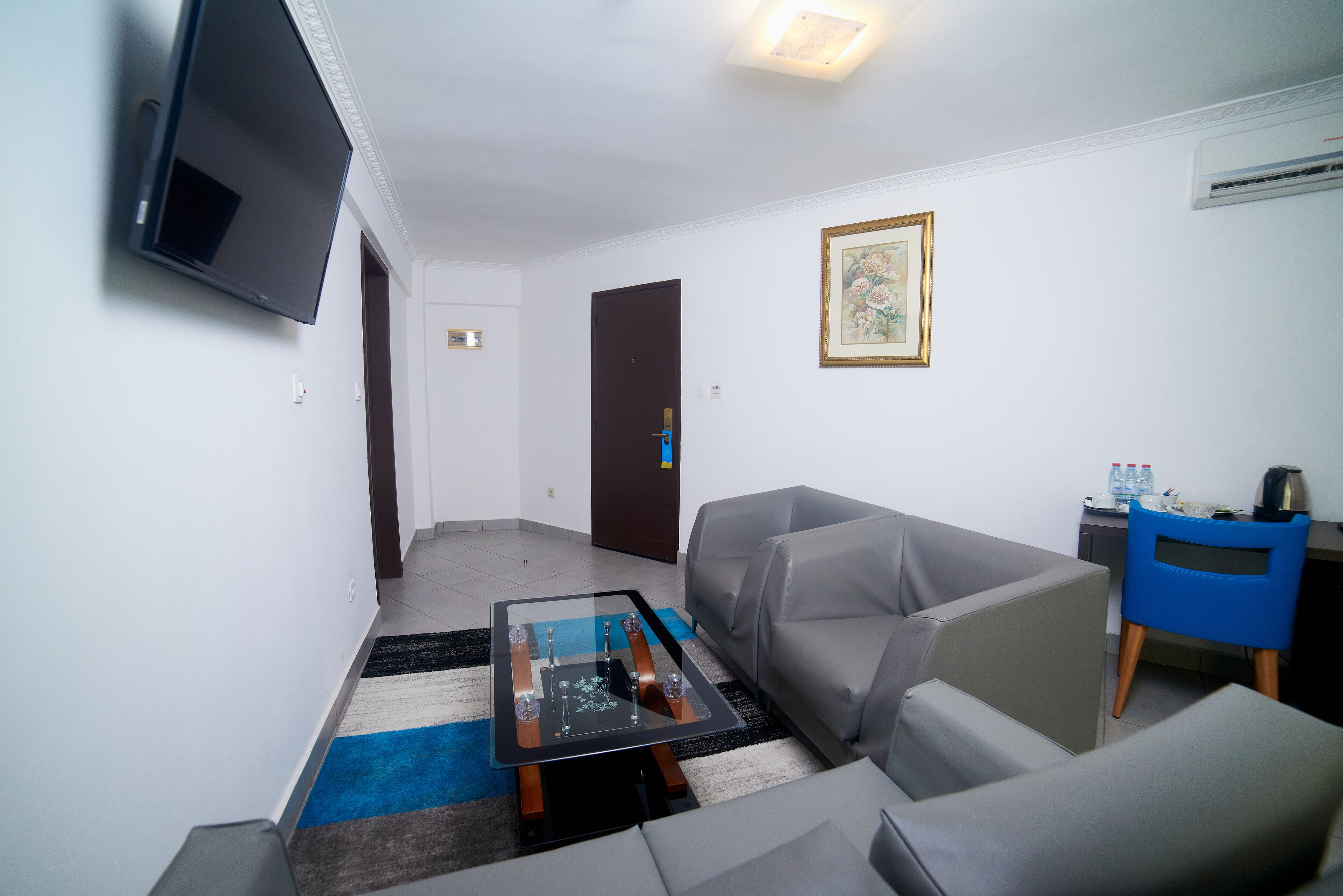 deluxe suite | living area | 43-inch smart tv with digital channels, tv, smart speakers