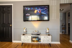 Relax in this living room with a flat-screen TV, console table, and board games.