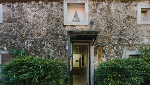 A stone building with a doorway leading to an interior space. - Mountain Traveler Inn (New Taipei City)