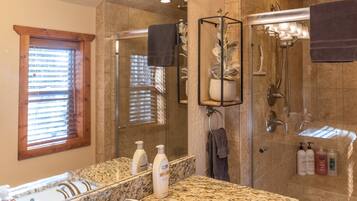 Shower, hair dryer, towels, shampoo