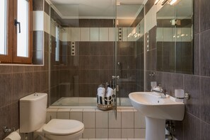 Bathtub, hair dryer, towels