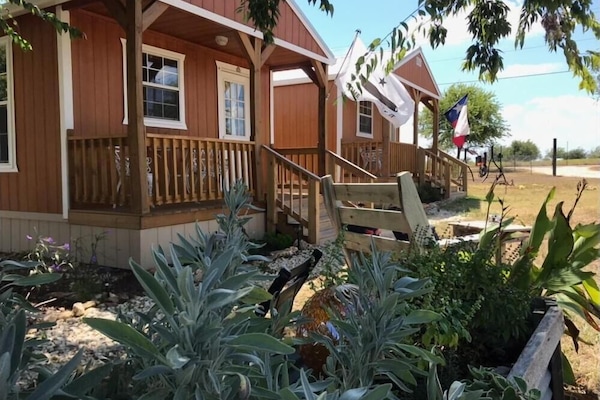 Alamo cabin in forefront. We have several other cabins and camping too