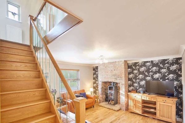 TV, fireplace, books, offices