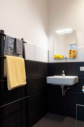 Shower, rainfall showerhead, hair dryer, towels