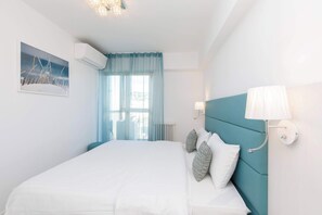 2 dormitorios, tabla de planchar con plancha, cuna de viaje y wifi