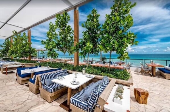 Outdoor dining - Spectacular Waterview Condo at BeachWalk #1401 (Hallandale Beach)