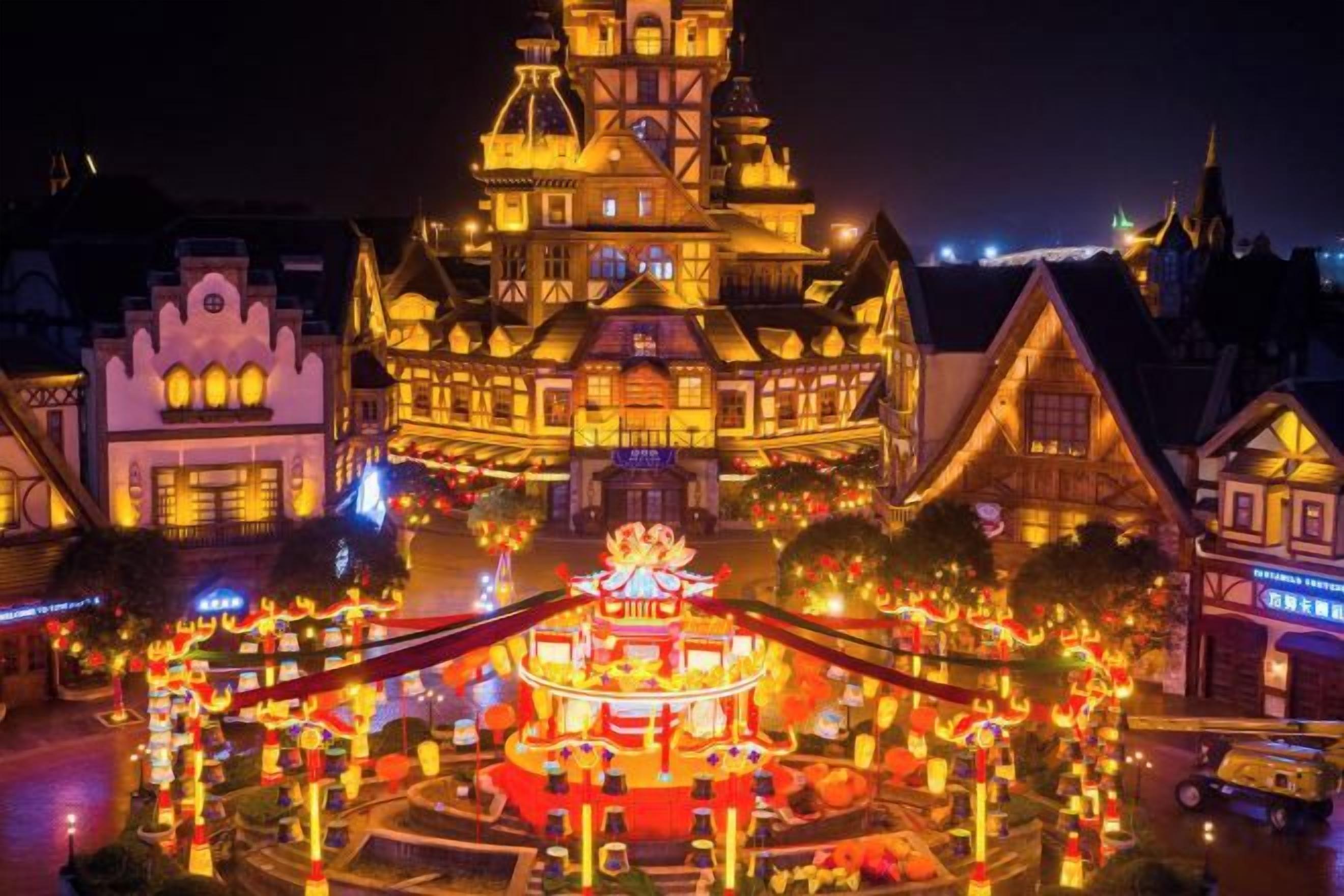 A brightly lit building with a central tower and surrounding structures, likely a hotel or historic building.