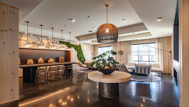 A modern interior with a kitchen area, dining space, and seating area. - The Lodge 30A (Santa Rosa Beach)
