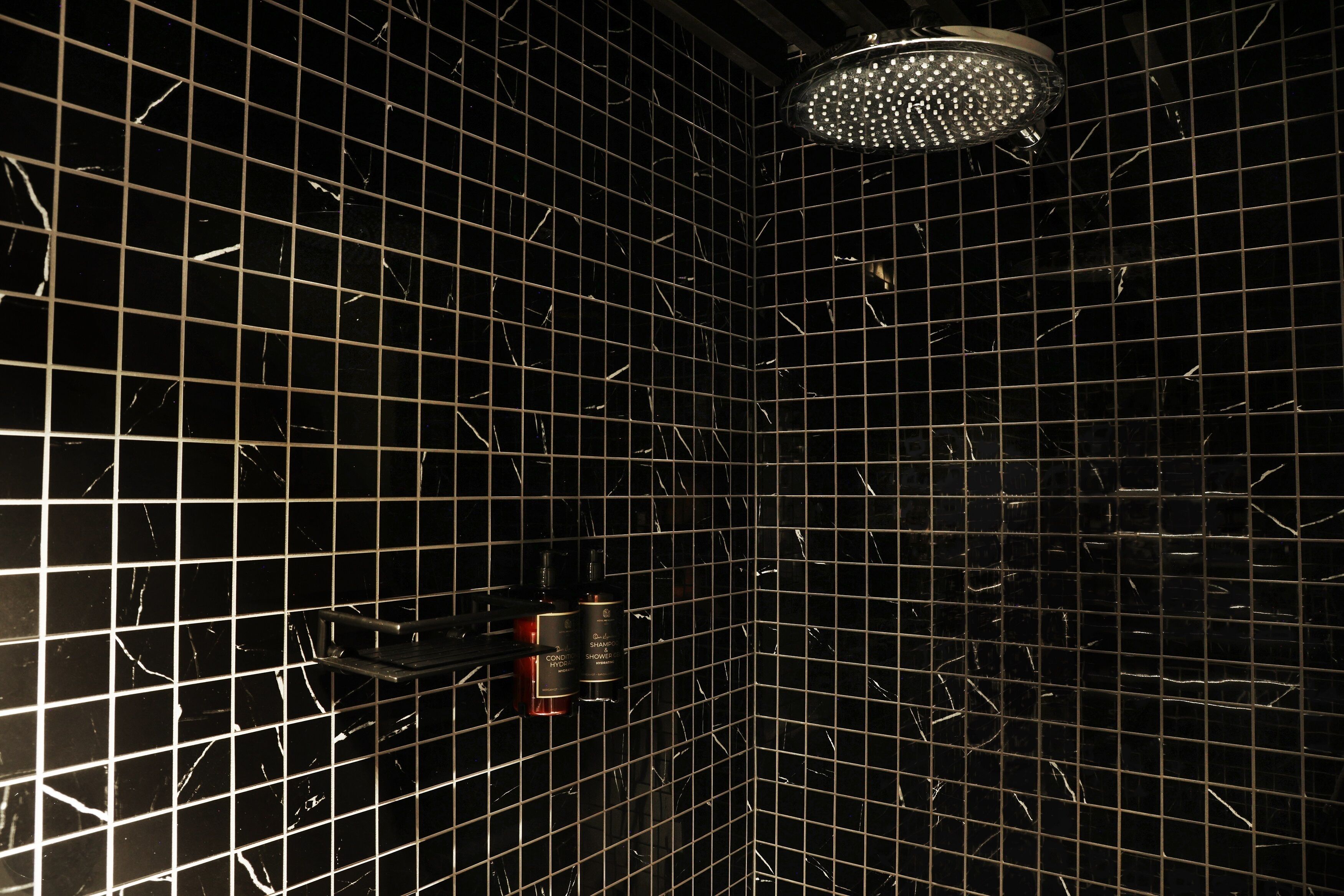 junior suite | bathroom | shower, rainfall showerhead, free toiletries, hair dryer