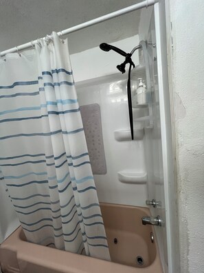 Combined shower/bathtub, hair dryer, towels, soap