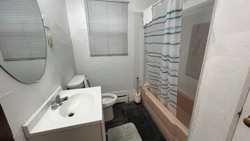 Combined shower/tub, hair dryer, towels, soap