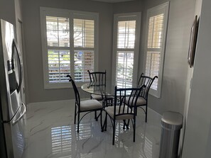 Enjoy cooking in this well-equipped kitchen with a central island and comfortable seating for four.