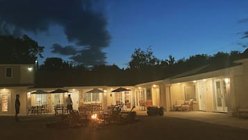 A courtyard with outdoor seating and a fire pit.