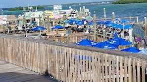 Enjoy waterfront dining and shopping at this bustling pier with scenic views of the water and surrounding land.