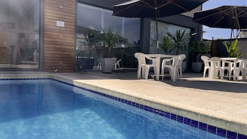 Outdoor pool, open 8:00 AM to 10:00 PM, sun loungers