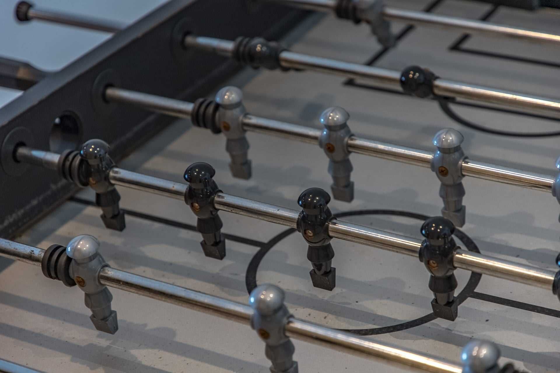A close-up of a metal structure with multiple rods and spherical knobs, likely part of a mechanical or industrial system.