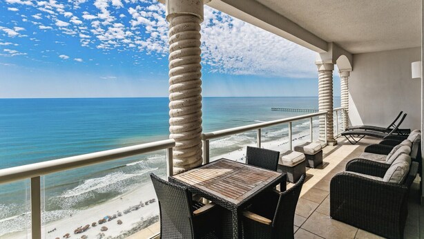 A balcony with wicker furniture overlooking a beach and ocean. - BC-2003 3B Beach Club Gulf Front /Daily Beach Chairs! (Pensacola Beach)