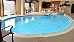 An indoor swimming pool with lounge chairs and a lifebuoy near the pool. - Cozy 2 BR Condo With Spectacular View of Mount Snow! (Dover)