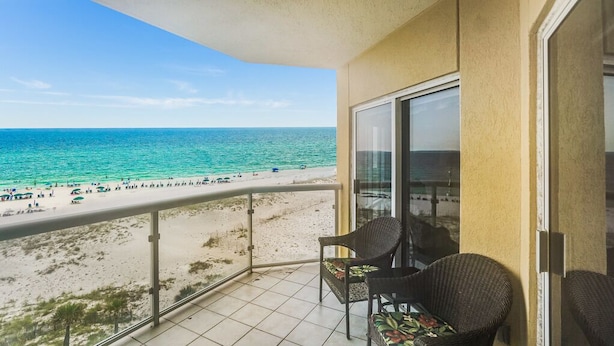 A balcony with a view of a beach and ocean. - Great Rates at Emerald Isle 506 - 2B Gulf Front Views! (Pensacola Beach)