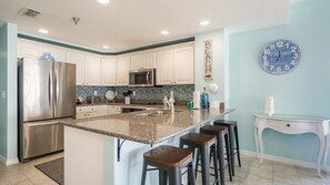 Microwave, dishwasher, coffee/tea maker, cookware/dishes/utensils