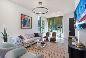 4-Bedroom | Living area | 50-inch Smart TV with digital channels - The Grove by AvantStay – Stylish Group Stay with Private Bathrooms (Nashville)