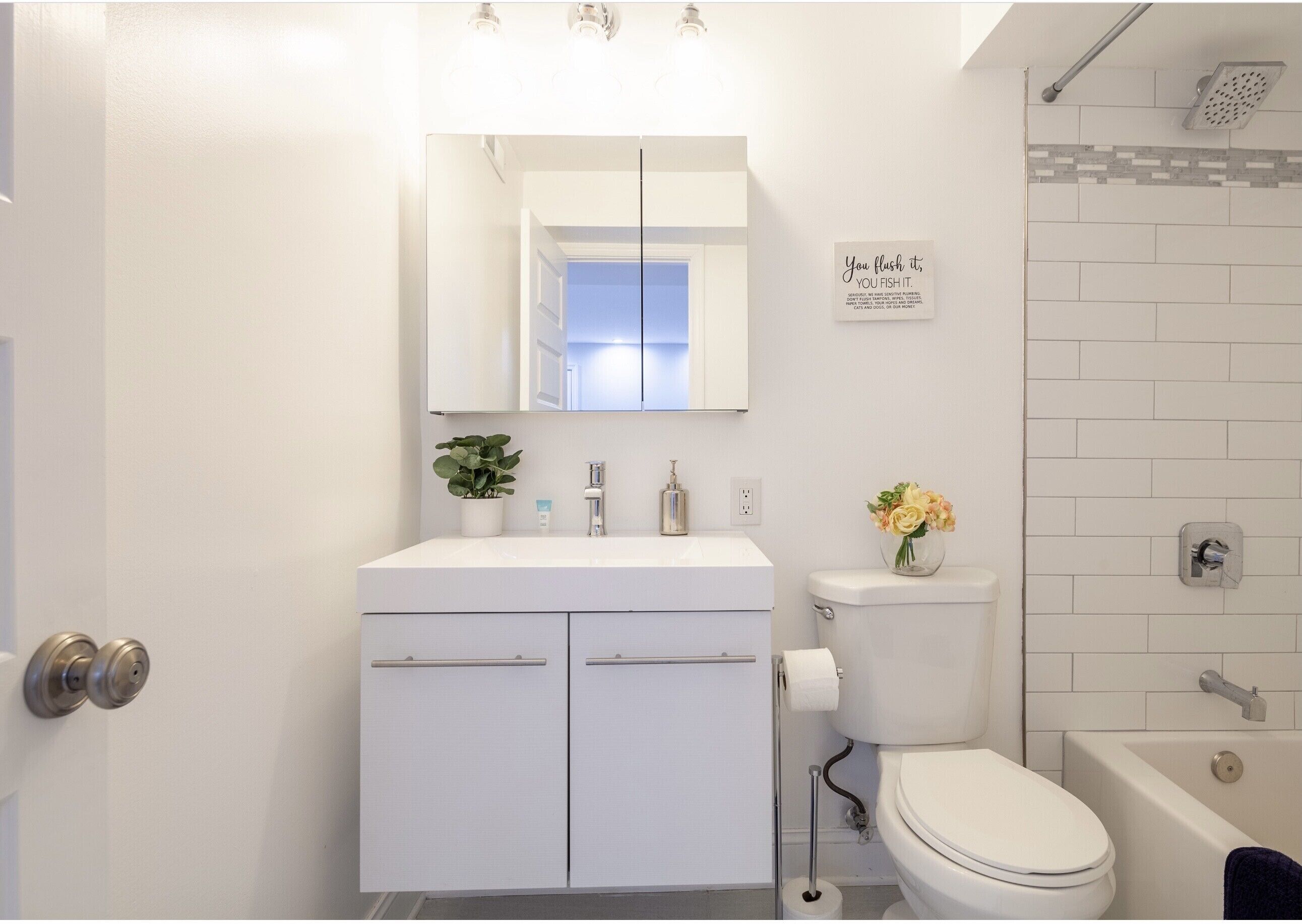 Combined shower/tub, hair dryer, towels, soap