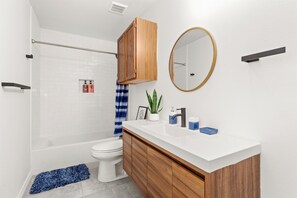 Shower, hair dryer, towels, shampoo