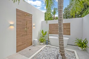 Shower, hair dryer, towels, soap