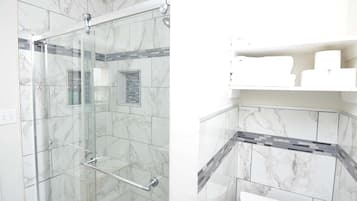 Shower, hair dryer, towels, soap