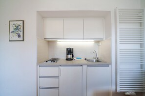 Fridge, stovetop, coffee/tea maker, cookware/dishes/utensils