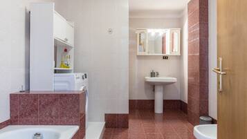 Bathtub, hair dryer, towels