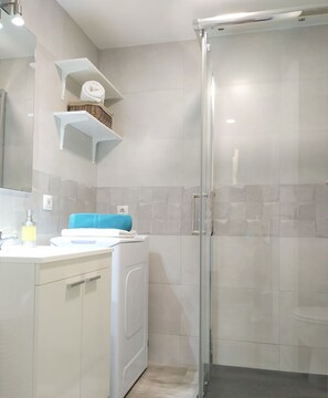 Shower, hair dryer, towels, soap