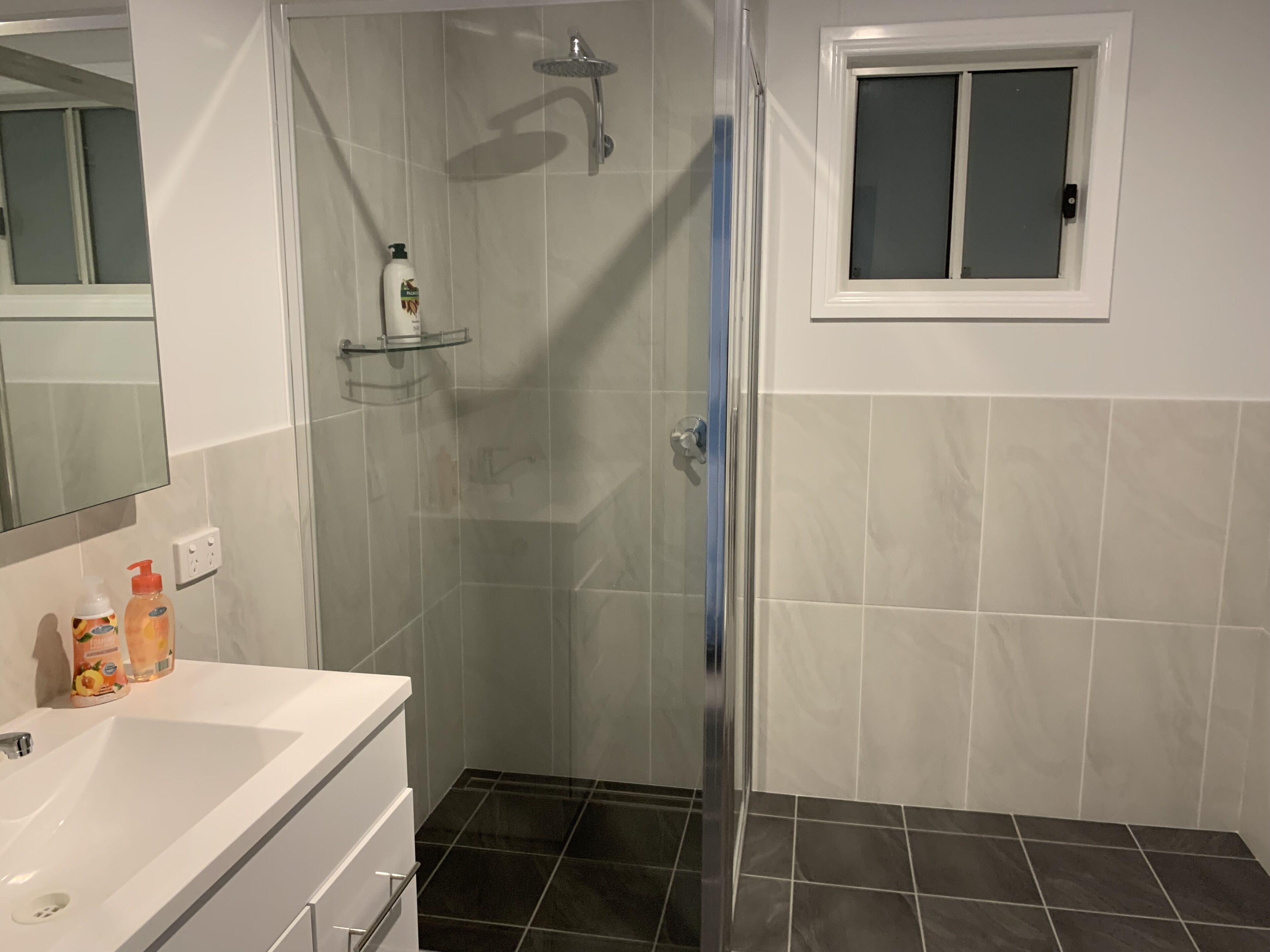Shower, hair dryer, towels, shampoo