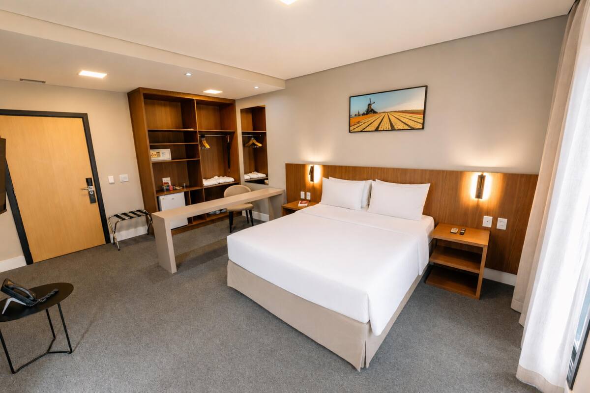 Deluxe Room, 1 Queen Bed, Pool View | In-room safe, desk, free WiFi, bed sheets
