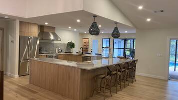 Fridge, stovetop, dishwasher, coffee/tea maker