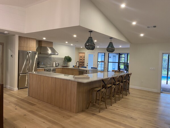 Fridge, stovetop, dishwasher, coffee/tea maker