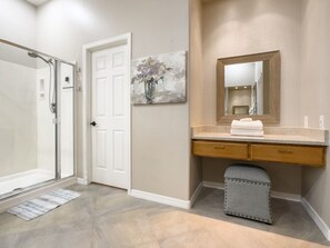 Shower, hair dryer, towels, shampoo