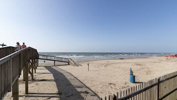 On the beach, sun loungers, beach towels