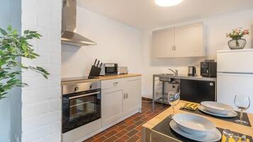 Fridge, microwave, stovetop, coffee/tea maker