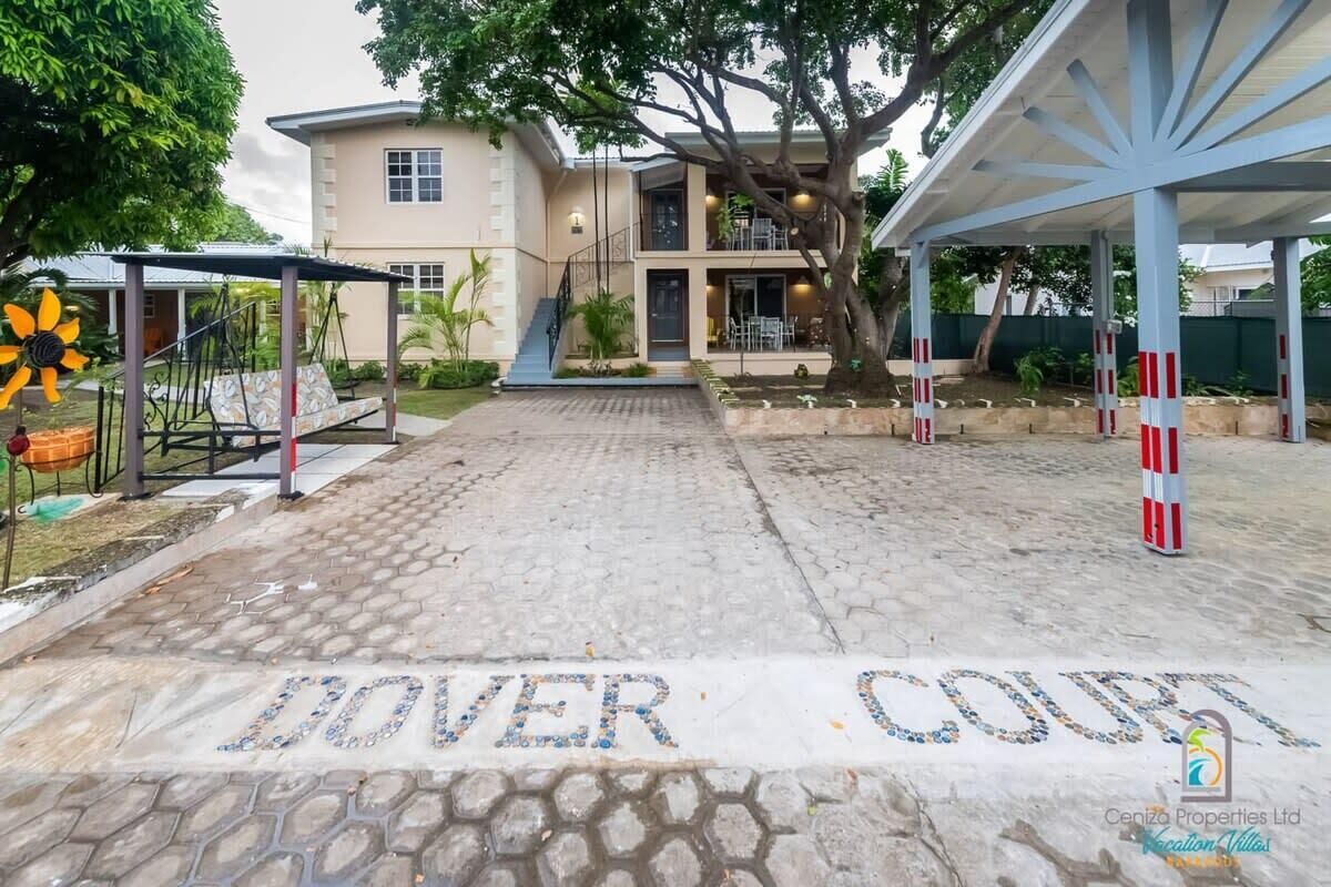 A paved entrance to a property with the words "DOVER COURT" on the ground.