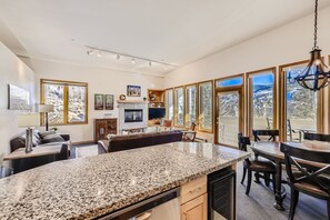 Enjoy meals in the well-appointed kitchen with a dining area offering a view of the surrounding landscape.