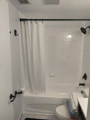 Combined shower/tub, hair dryer, towels, soap