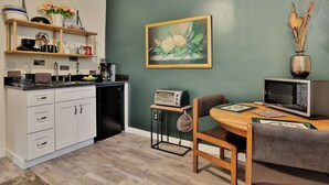 A compact kitchen with white cabinets, a coffee maker, and a microwave on the counter. - Tranquil Guest Suite in Paradise with Private Pool Walking Distance to Town
 (Saint Augustine)