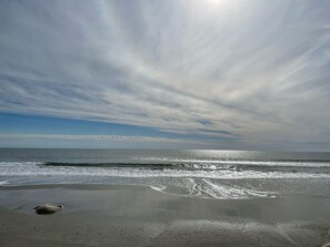 On the beach, sun-loungers