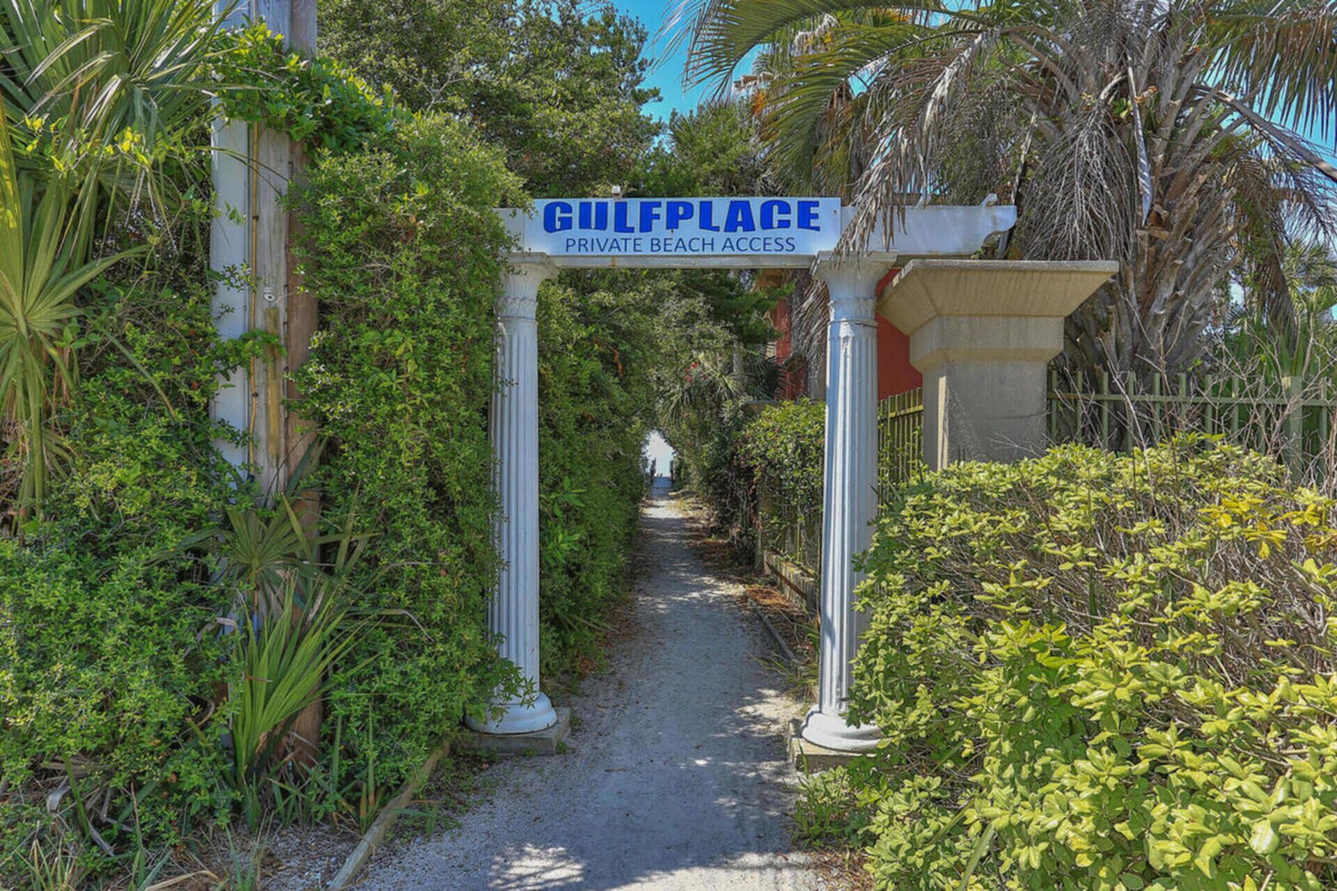 A pathway leading to a gated area labeled 'GULFPLACE PRIVATE BEACH ACCESS'.