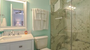 Combined shower/bathtub, hair dryer, towels, soap
