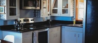 This A-frame is surrounded by mountain ranges that you can enjoy from the many windows