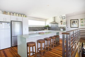 Fridge, microwave, oven, stovetop - Narrawallee Beach. A family sized three bedroom Beach House by the Beach. (Narrawallee Beach)