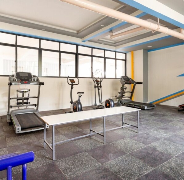 Stay active with our fitness room featuring treadmills, an elliptical trainer, and a stationary bike.
